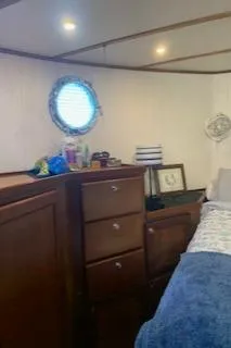 Lazy Days Yacht Photos Pics Interior of 2005 Great Harbour GH37 boat with wooden cabinets and porthole window.