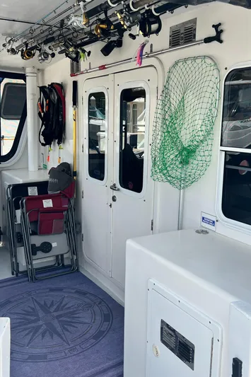 Lazy Days Yacht Photos Pics 2005 Great Harbour GH37 boat interior with fishing gear and storage.