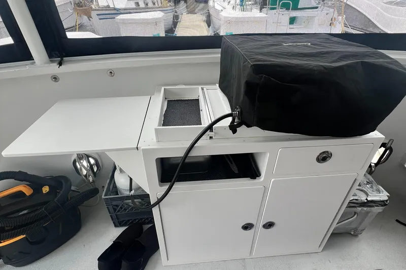 Lazy Days Yacht Photos Pics Outdoor kitchen setup on 2005 Great Harbour GH37 boat with covered grill and storage.