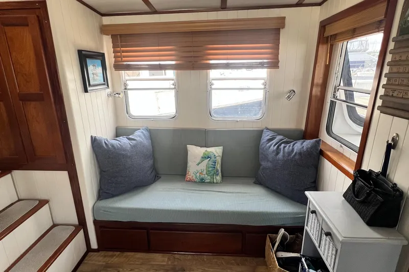 Lazy Days Yacht Photos Pics Cozy interior of 2005 Great Harbour GH37 with cushioned seating and nautical decor.