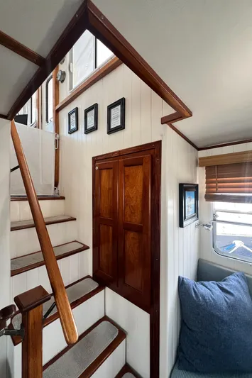 Lazy Days Yacht Photos Pics Interior of 2005 Great Harbour GH37 yacht with wooden stairs and cozy seating area.