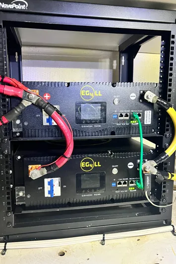 Lazy Days Yacht Photos Pics Rack-mounted electronic equipment with cables, featuring two EG4 LL units in a NavePoint enclosure.