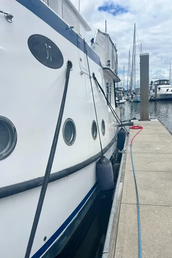 Lazy Days Yacht Photos Pics 2005 Great Harbour GH37 yacht docked at marina with cloudy sky.