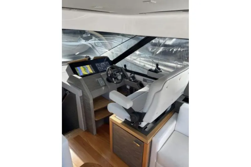 Mi Dia Yacht Photos Pics 2019 Tiara Yachts F53 Flybridge helm with modern controls and comfortable seating.