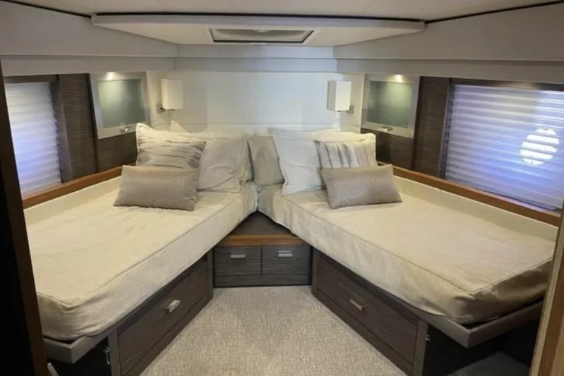 Mi Dia Yacht Photos Pics Luxurious 2019 Tiara Yachts F53 Flybridge cabin with twin beds and modern decor.