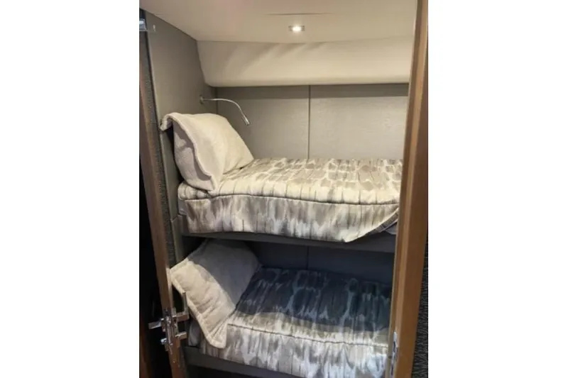 Mi Dia Yacht Photos Pics 2019 Tiara Yachts F53 Flybridge interior with cozy bunk beds.