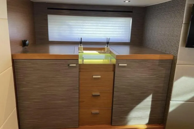 Mi Dia Yacht Photos Pics Luxurious interior of 2019 Tiara Yachts F53 Flybridge with modern cabinetry and ambient lighting.