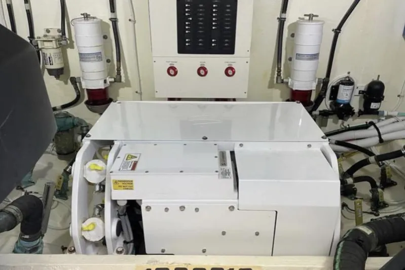 Mi Dia Yacht Photos Pics Engine room of 2019 Tiara Yachts F53 Flybridge with mechanical components and control panel.