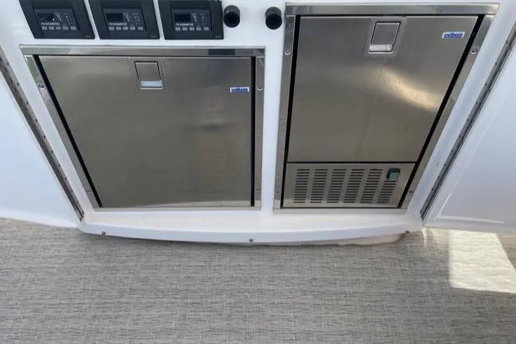 Mi Dia Yacht Photos Pics Stainless steel appliances on 2019 Tiara Yachts F53 Flybridge, featuring control panels.