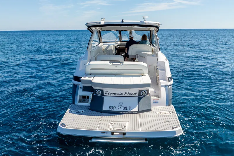 "plymouth Breeze" Yacht Photos Pics 2020 Regal 35 Sport Coupe yacht cruising on open ocean waters.