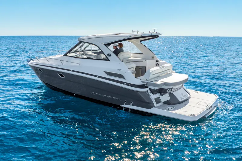 "plymouth Breeze" Yacht Photos Pics 2020 Regal 35 Sport Coupe cruising on open blue sea.