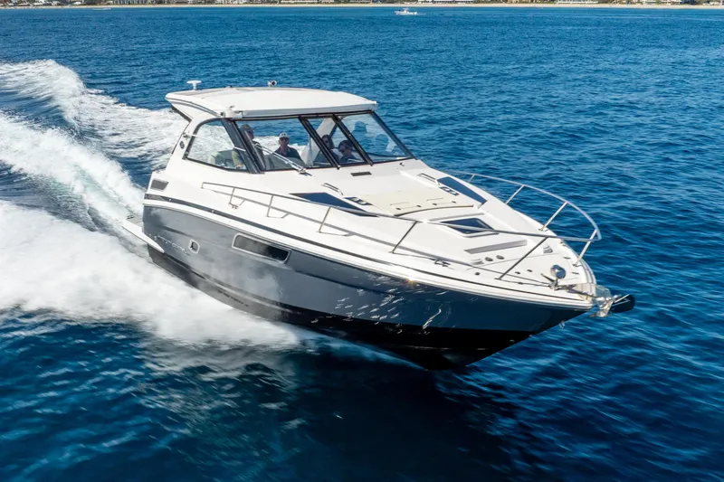 "plymouth Breeze" Yacht Photos Pics 2020 Regal 35 Sport Coupe cruising on open blue water.