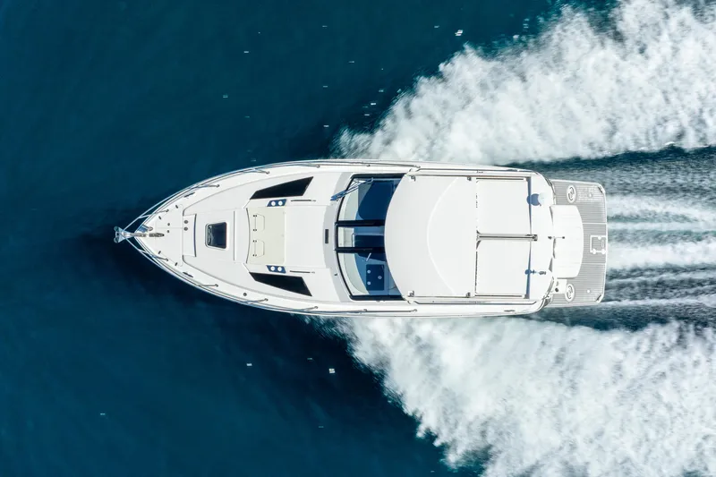 "plymouth Breeze" Yacht Photos Pics Aerial view of 2020 Regal 35 Sport Coupe cruising on blue water.