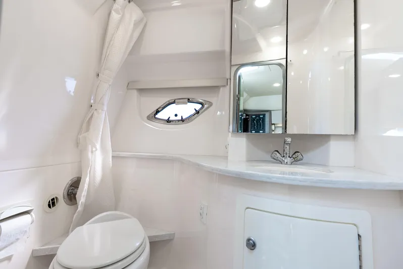 "plymouth Breeze" Yacht Photos Pics 2020 Regal 35 Sport Coupe bathroom with modern fixtures and sleek design.