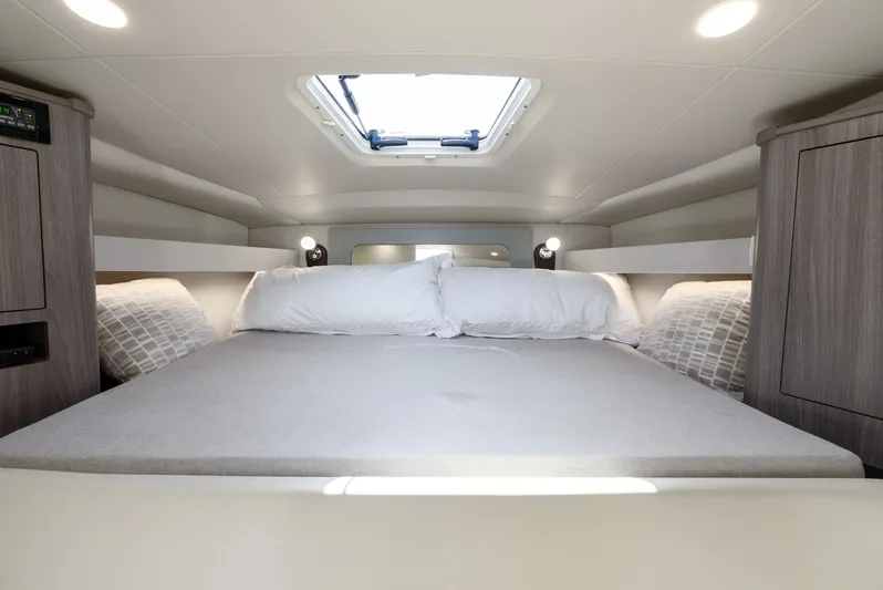 "plymouth Breeze" Yacht Photos Pics 2020 Regal 35 Sport Coupe interior cabin with bed and skylight.