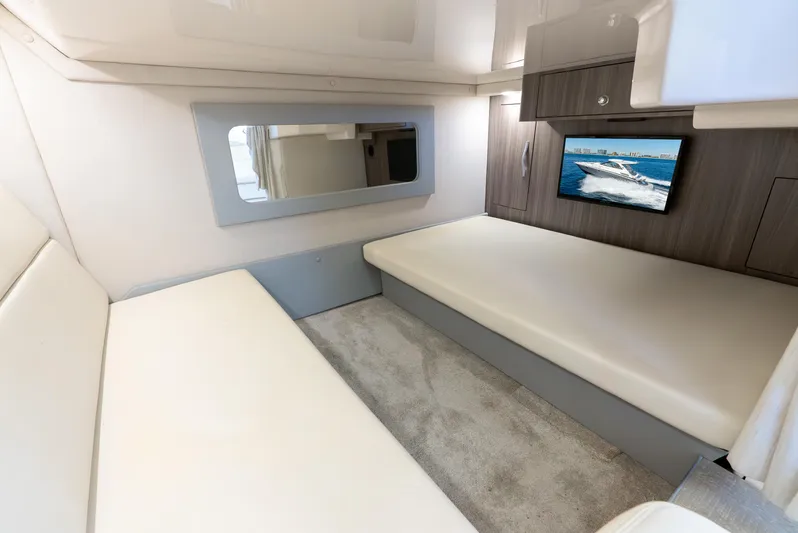 "plymouth Breeze" Yacht Photos Pics Interior of 2020 Regal 35 Sport Coupe with modern seating and wall-mounted TV.
