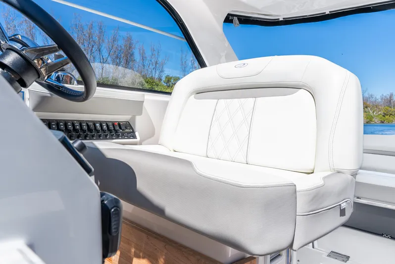 "plymouth Breeze" Yacht Photos Pics 2020 Regal 35 Sport Coupe interior with white leather seating and control panel.