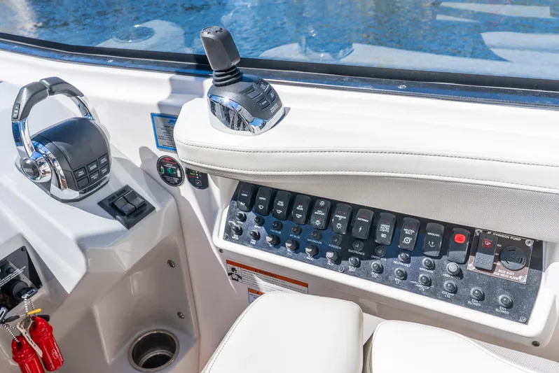 "plymouth Breeze" Yacht Photos Pics Control panel of 2020 Regal 35 Sport Coupe boat with joystick and switches.