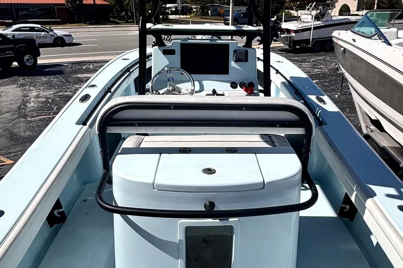  Yacht Photos Pics 2021 Yellowfin 26 Hybrid boat interior with steering console and seating.