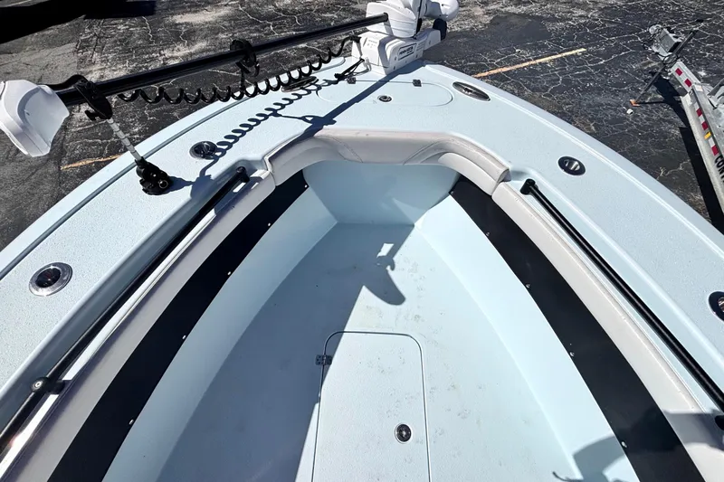  Yacht Photos Pics 2021 Yellowfin 26 Hybrid boat deck with trolling motor and storage compartments.