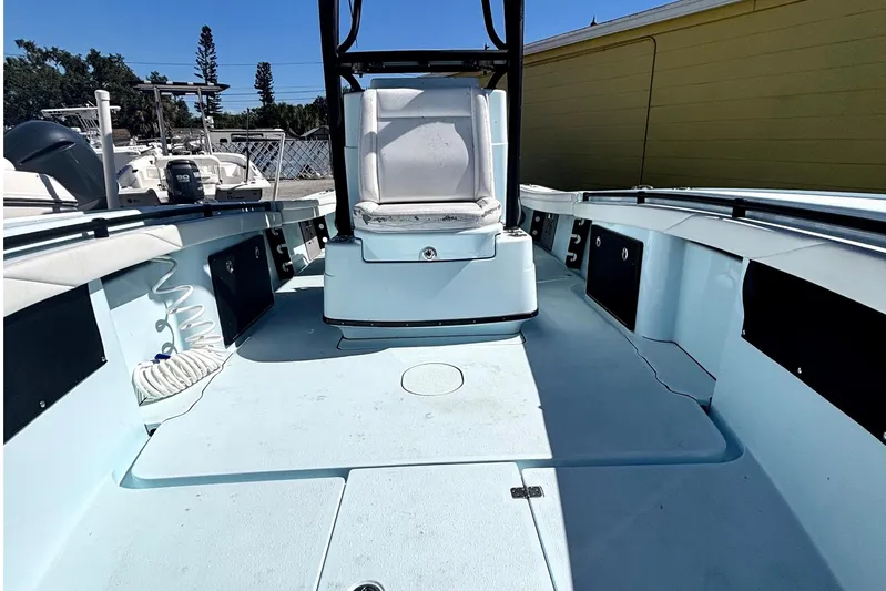  Yacht Photos Pics 2021 Yellowfin 26 Hybrid boat interior with seating and storage compartments.