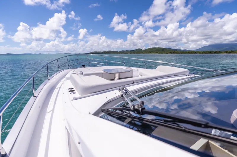 Salina Yacht Photos Pics 2024 Azimut S7 yacht cruising on clear blue waters under a bright sky.