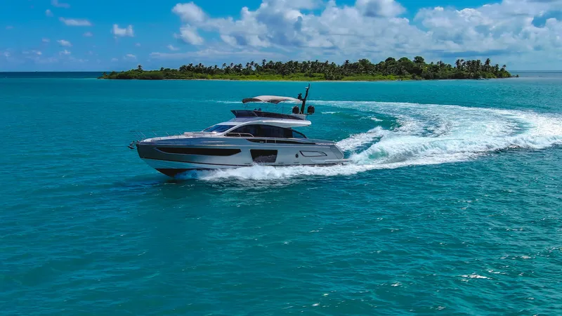 Salina Yacht Photos Pics 2024 Azimut S7 yacht cruising on turquoise waters near a tropical island.