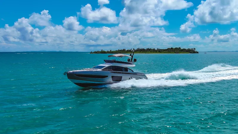 Salina Yacht Photos Pics 2024 Azimut S7 yacht cruising on turquoise ocean near tropical island.