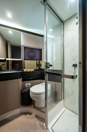 Salina Yacht Photos Pics Luxurious bathroom in 2024 Azimut S7 yacht with modern fixtures and glass shower.
