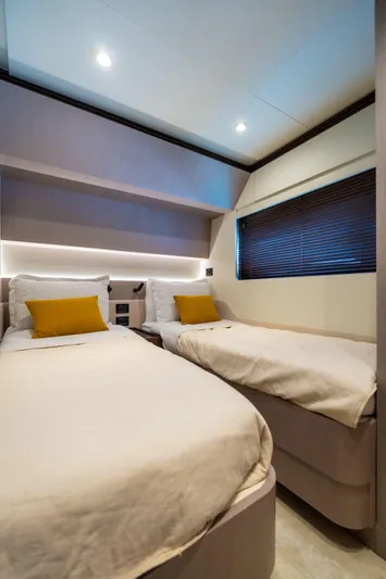Salina Yacht Photos Pics 2024 Azimut S7 yacht cabin with twin beds, modern design, and ambient lighting.