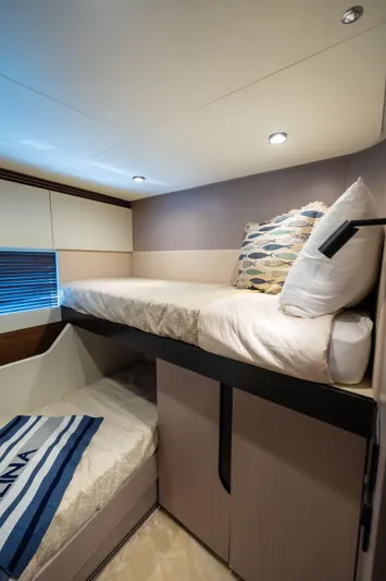 Salina Yacht Photos Pics 2024 Azimut S7 yacht cabin with bunk beds, modern design, and cozy lighting.