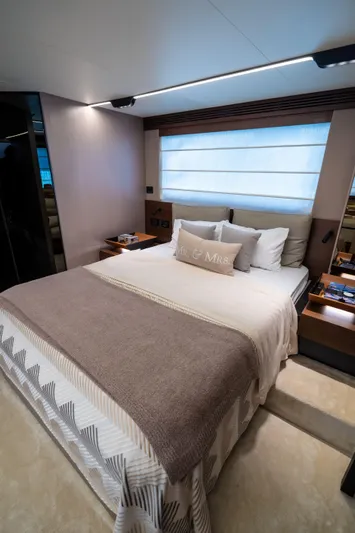 Salina Yacht Photos Pics Luxurious bedroom interior of 2024 Azimut S7 yacht with elegant bedding and modern design.