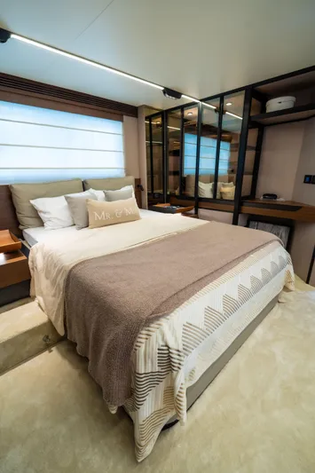 Salina Yacht Photos Pics Luxurious bedroom interior of 2024 Azimut S7 yacht with elegant bedding and modern design.