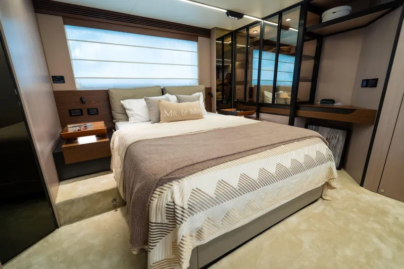 Salina Yacht Photos Pics Luxurious bedroom interior of 2024 Azimut S7 yacht with elegant decor and modern furnishings.