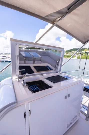 Salina Yacht Photos Pics 2024 Azimut S7 yacht with outdoor kitchen and scenic marina view.