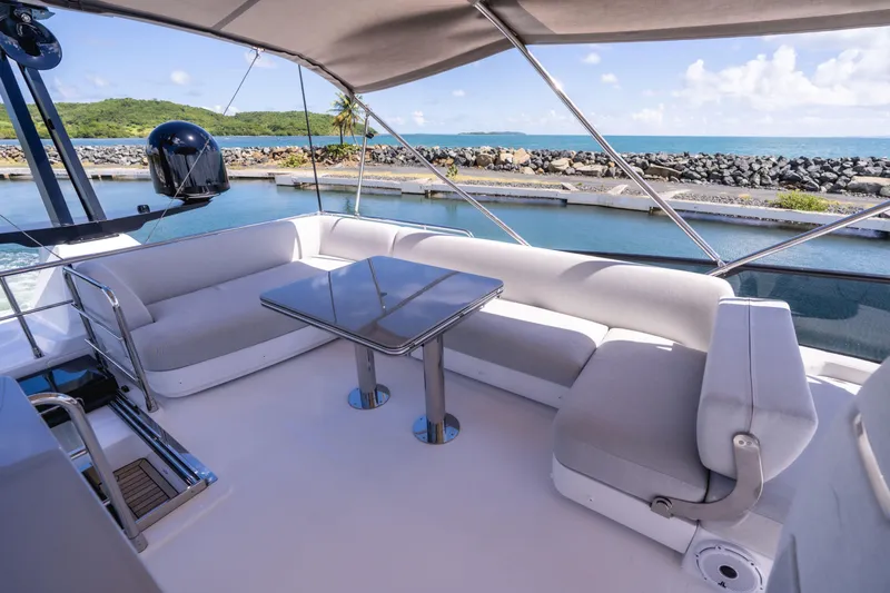 Salina Yacht Photos Pics Luxurious seating area on 2024 Azimut S7 yacht with ocean view.
