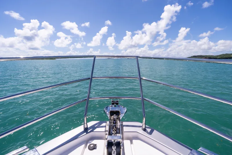 Salina Yacht Photos Pics Bow view of 2024 Azimut S7 yacht cruising on clear blue waters under a sunny sky.