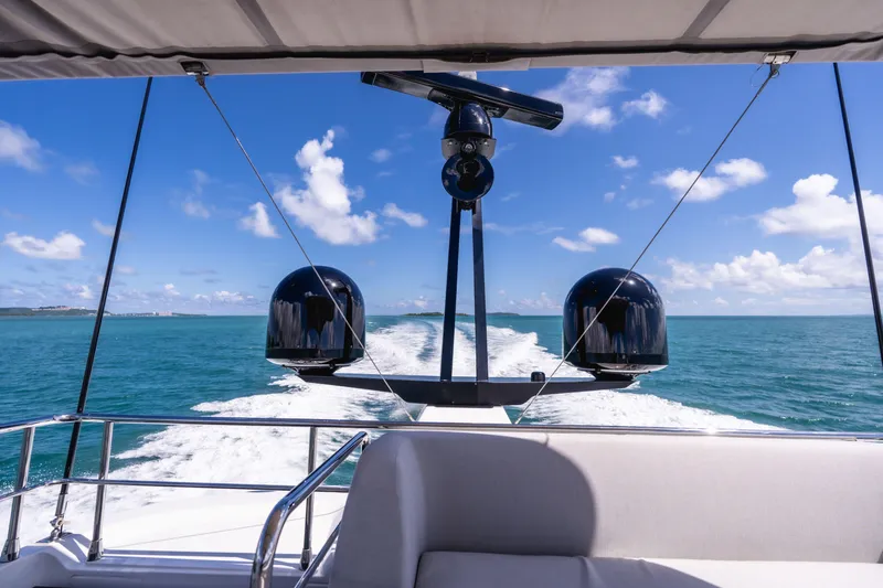 Salina Yacht Photos Pics 2024 Azimut S7 yacht cruising on clear blue ocean under a sunny sky.