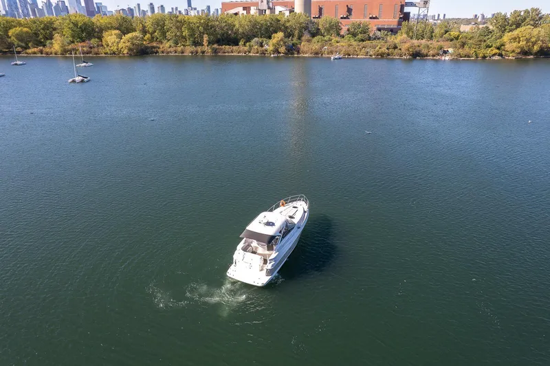  Yacht Photos Pics Aerial view of 2009 Regal Commodore 4060 yacht on a calm river.