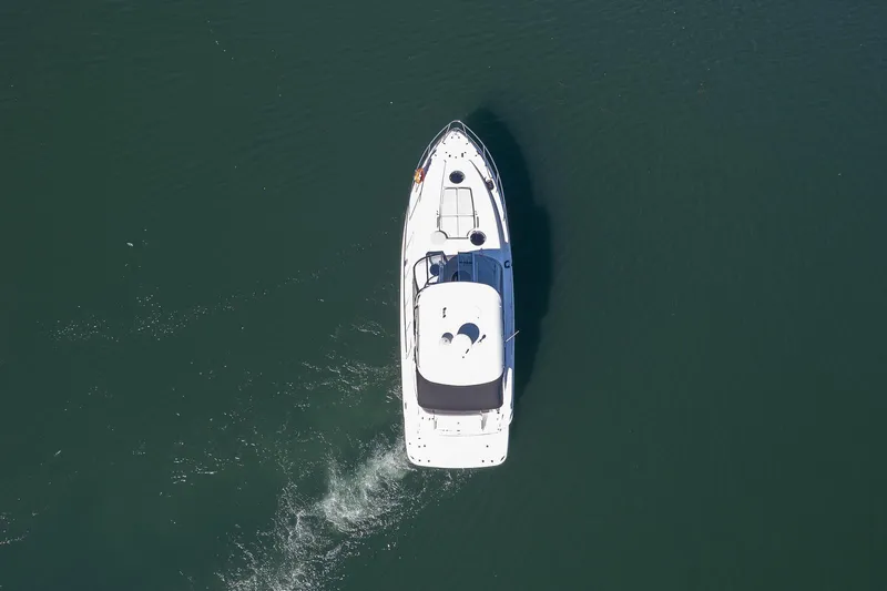  Yacht Photos Pics Aerial view of 2009 Regal Commodore 4060 yacht cruising on calm water.