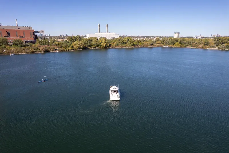  Yacht Photos Pics Aerial view of 2009 Regal Commodore 4060 boat on a calm lake.