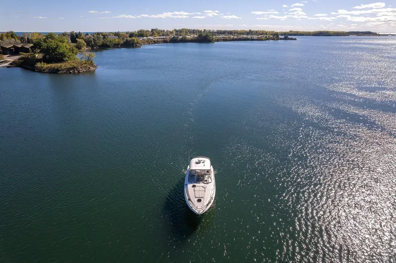  Yacht Photos Pics Aerial view of 2009 Regal Commodore 4060 yacht on a serene lake.
