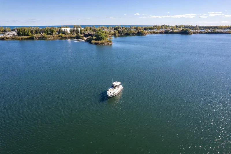  Yacht Photos Pics Aerial view of 2009 Regal Commodore 4060 yacht on a serene lake.