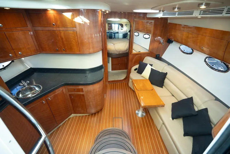  Yacht Photos Pics Luxurious interior of 2009 Regal Commodore 4060 yacht with wood finish and plush seating.