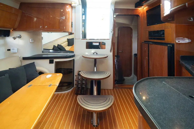  Yacht Photos Pics Interior of 2009 Regal Commodore 4060 yacht with wooden finishes and modern amenities.