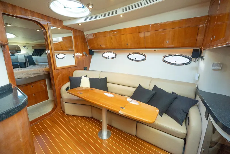  Yacht Photos Pics Luxurious interior of 2009 Regal Commodore 4060 yacht with plush seating and elegant wood finishes.
