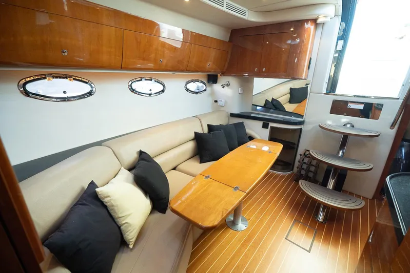  Yacht Photos Pics Luxurious interior of 2009 Regal Commodore 4060 yacht with wood accents and plush seating.