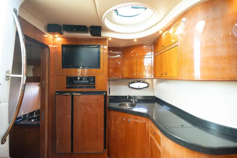  Yacht Photos Pics Luxurious 2009 Regal Commodore 4060 yacht interior with wood cabinetry and modern amenities.