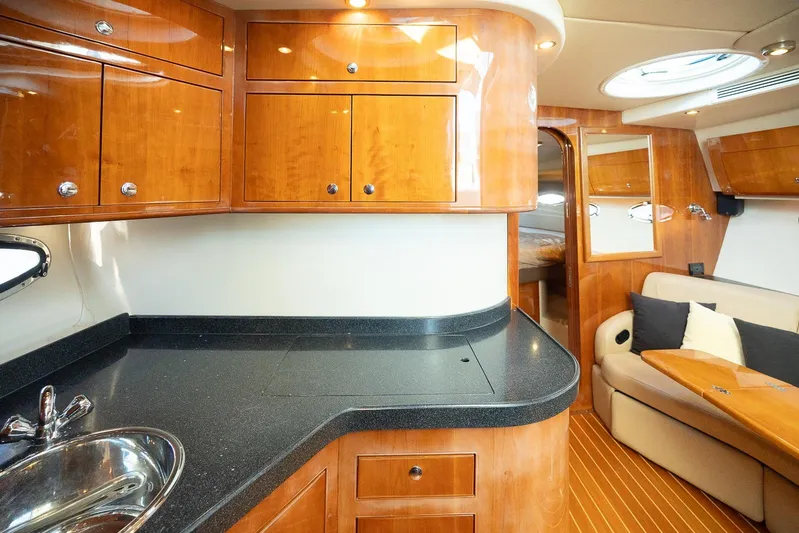  Yacht Photos Pics Luxurious 2009 Regal Commodore 4060 yacht interior with wood cabinetry and modern amenities.