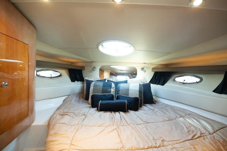  Yacht Photos Pics Luxurious cabin interior of 2009 Regal Commodore 4060 yacht with plush bedding.